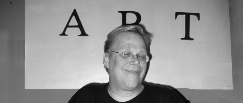 Fred Holliss in front of art